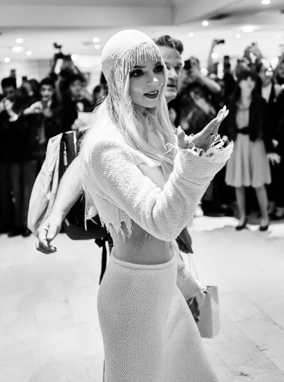 Cannes Furiosa press — porcelain midface, wide-set gaze, auburn framing under festival flash.
