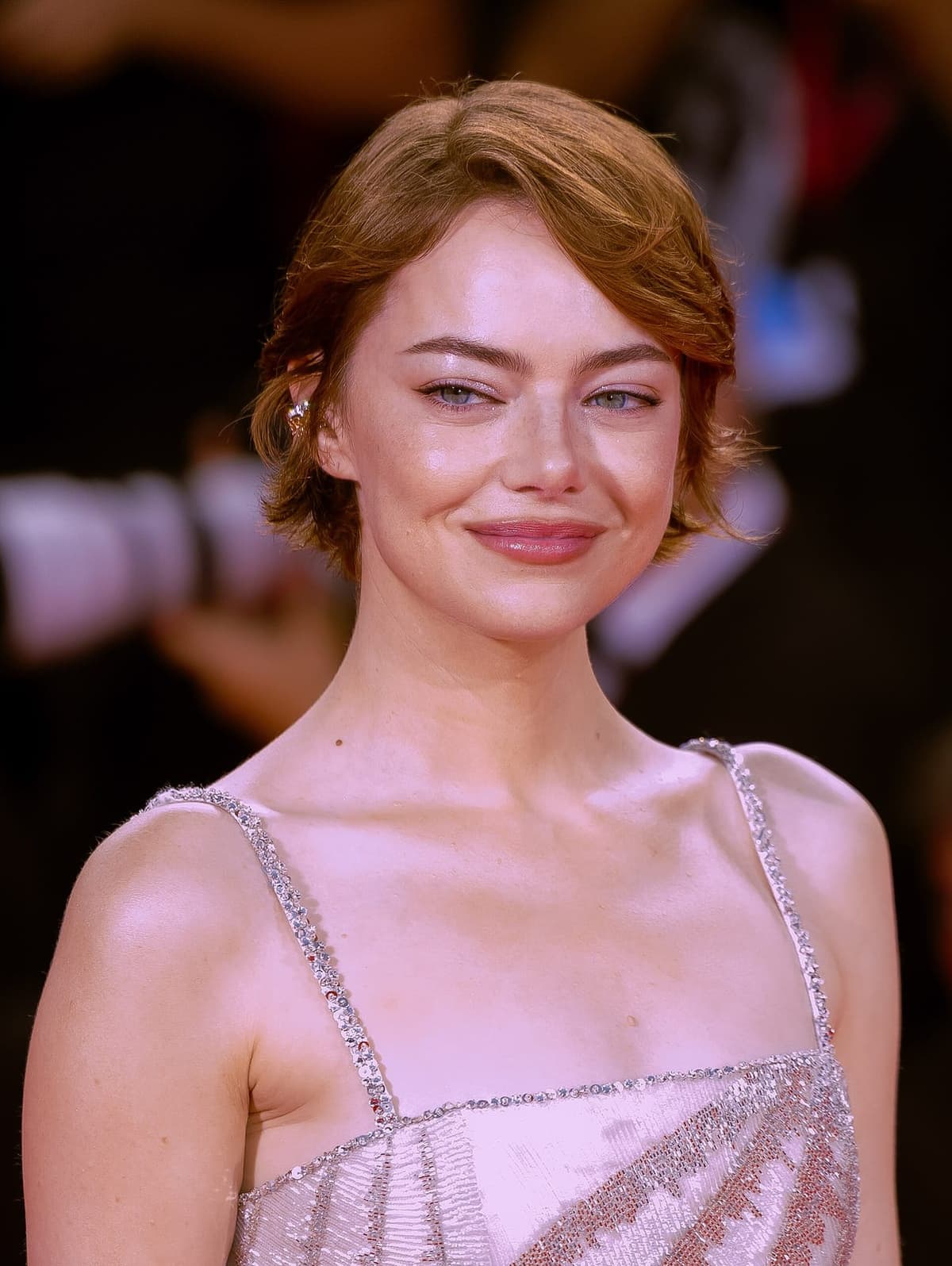 Festival flash stress test — soft taper and freckled glow under European carpet light.