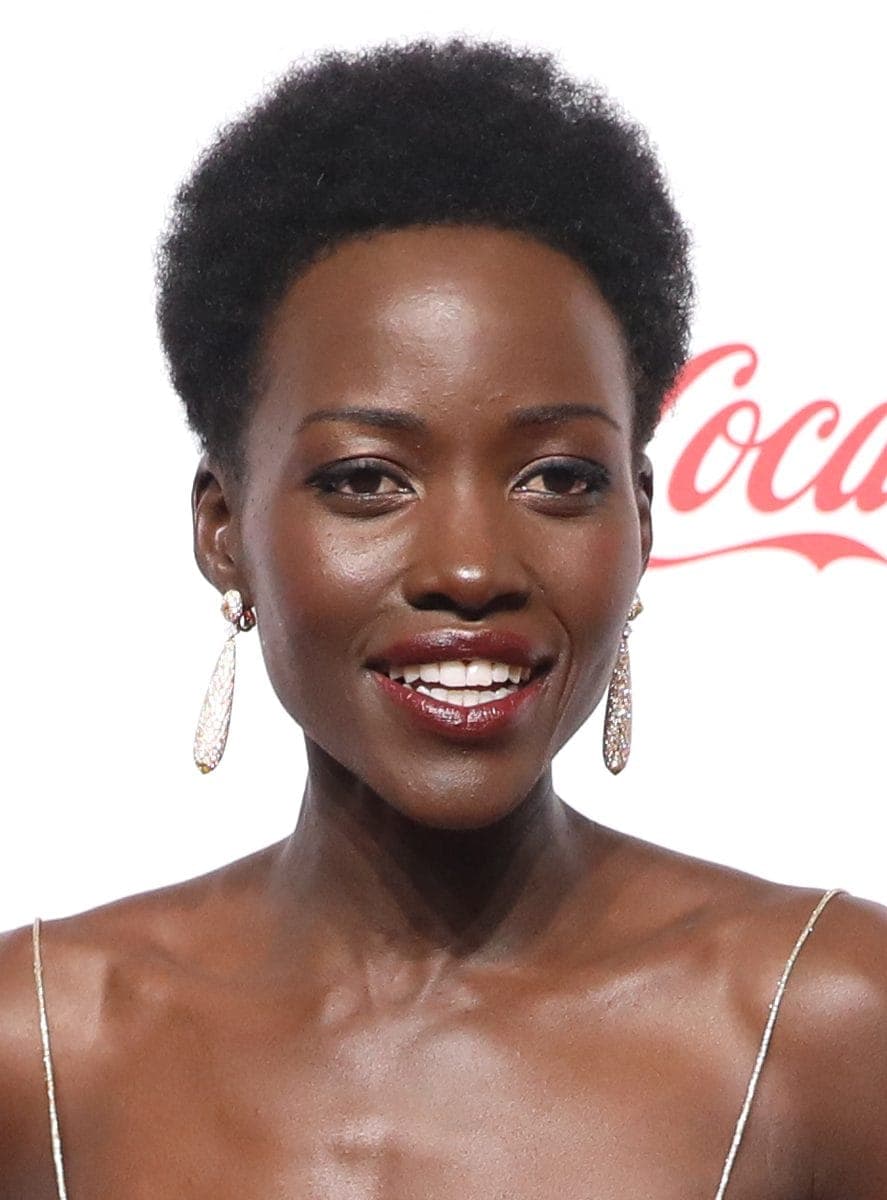 Soft-smile frontal — temple fifths and cheek architecture without carpet jewelry steal.